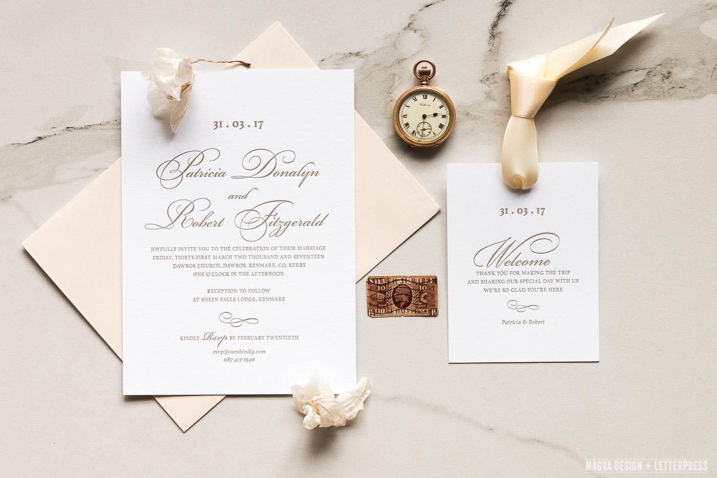 Wedding Invitation and Welcome note resting on a marble tile
