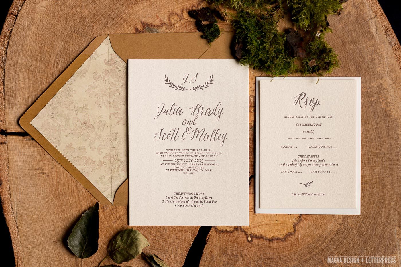 Wedding Invitation and RSVP resting on log